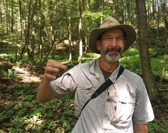 That's me — a happy entomologist and his dragonfly. Photo by Steve Collins.